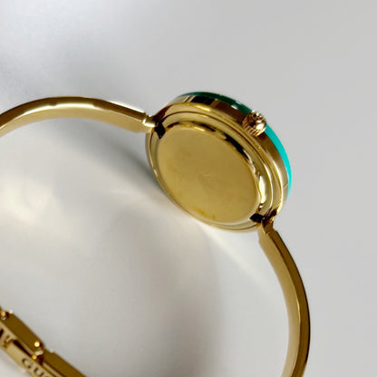 Gucci 1990s Interchangeable Bezel Gold Plated Bangle Watch with 12 bezels, case