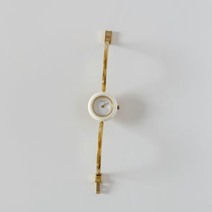 Gucci 1990s Interchangeable Bezel Gold Plated Bangle Watch with 12 bezels, case