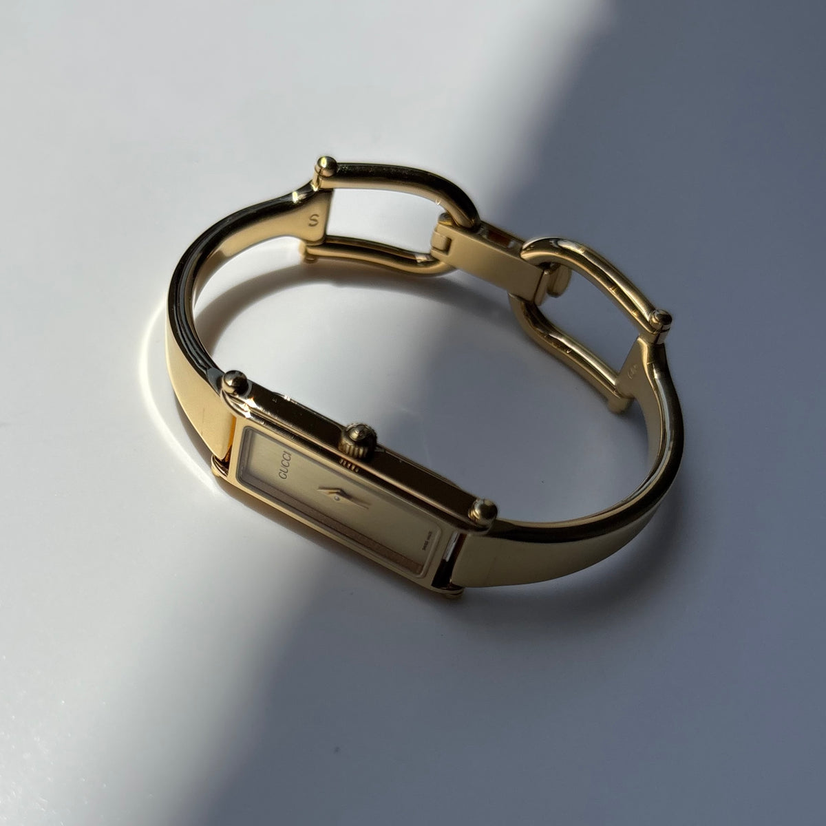 Gucci 1990s Rectangular Gold Dial Gold Plated Bangle Watch (Small)