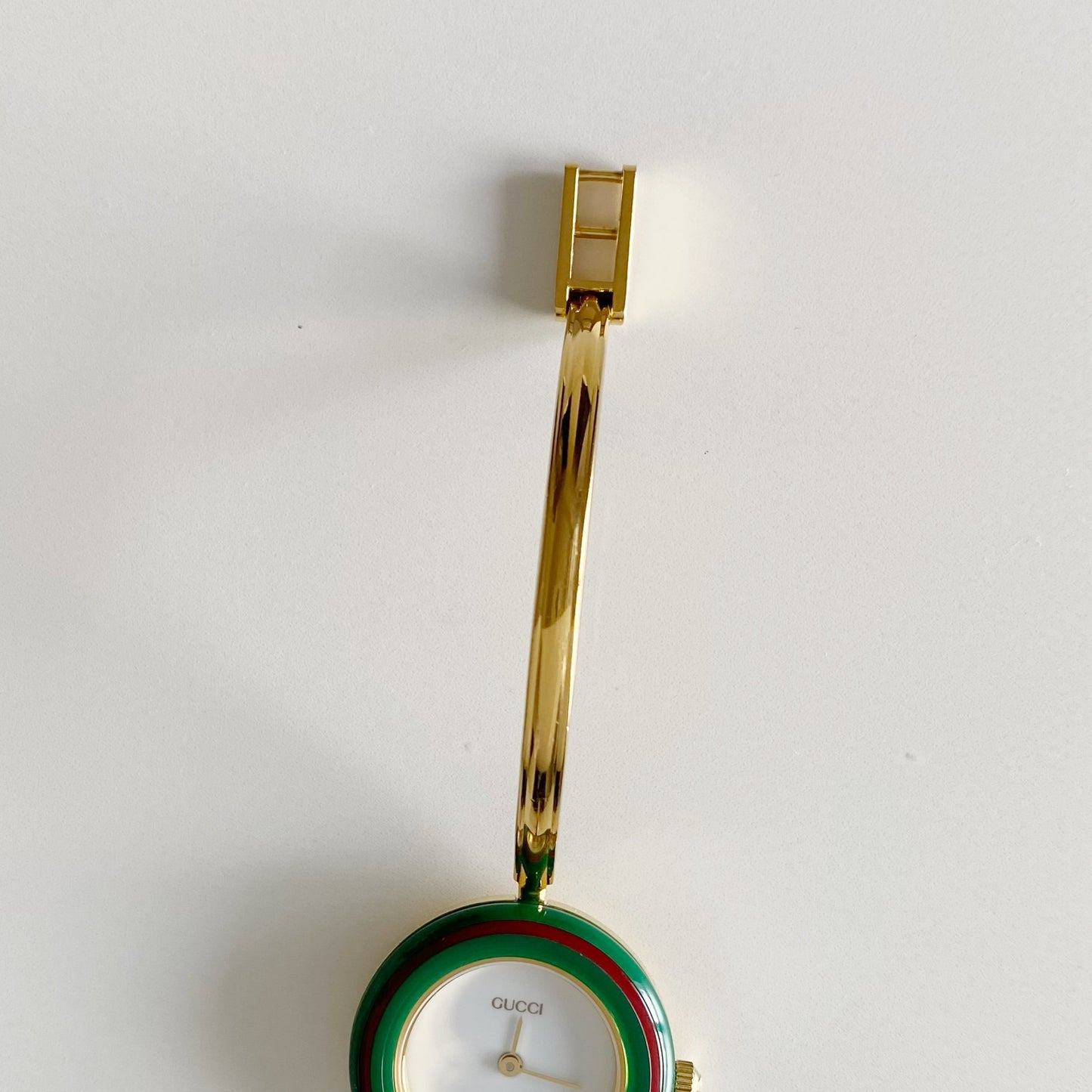 Gucci 1990s Interchangeable Bezel Gold Plated Bangle Watch with 12 bezels, case