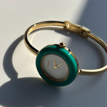 Gucci 1990s Interchangeable Bezel Gold Plated Bangle Watch with 12 bezels, case