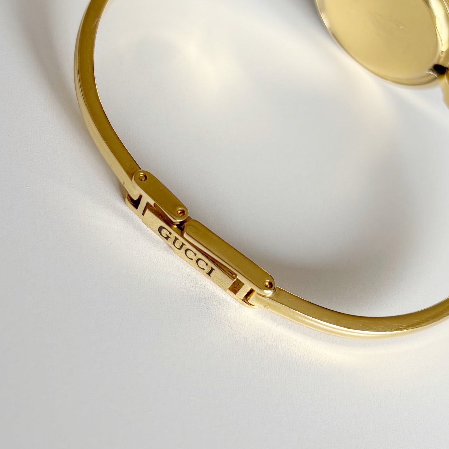 Gucci 1990s Interchangeable Bezel Gold Plated Bangle Watch with 12 bezels, case