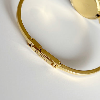 Gucci 1990s Interchangeable Bezel Gold Plated Bangle Watch with 12 bezels, case
