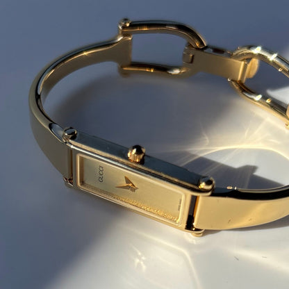 Gucci 1990s Rectangular Dial Gold Plated Bangle Watch