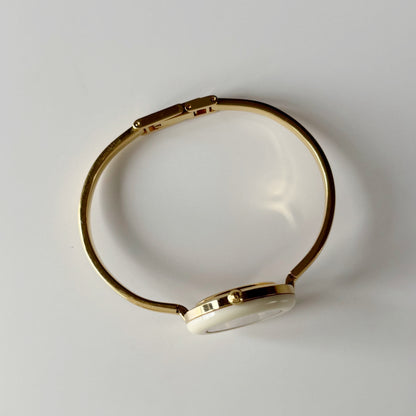 Gucci 1990s Interchangeable Bezel Gold Plated Bangle Watch with 12 bezels, case