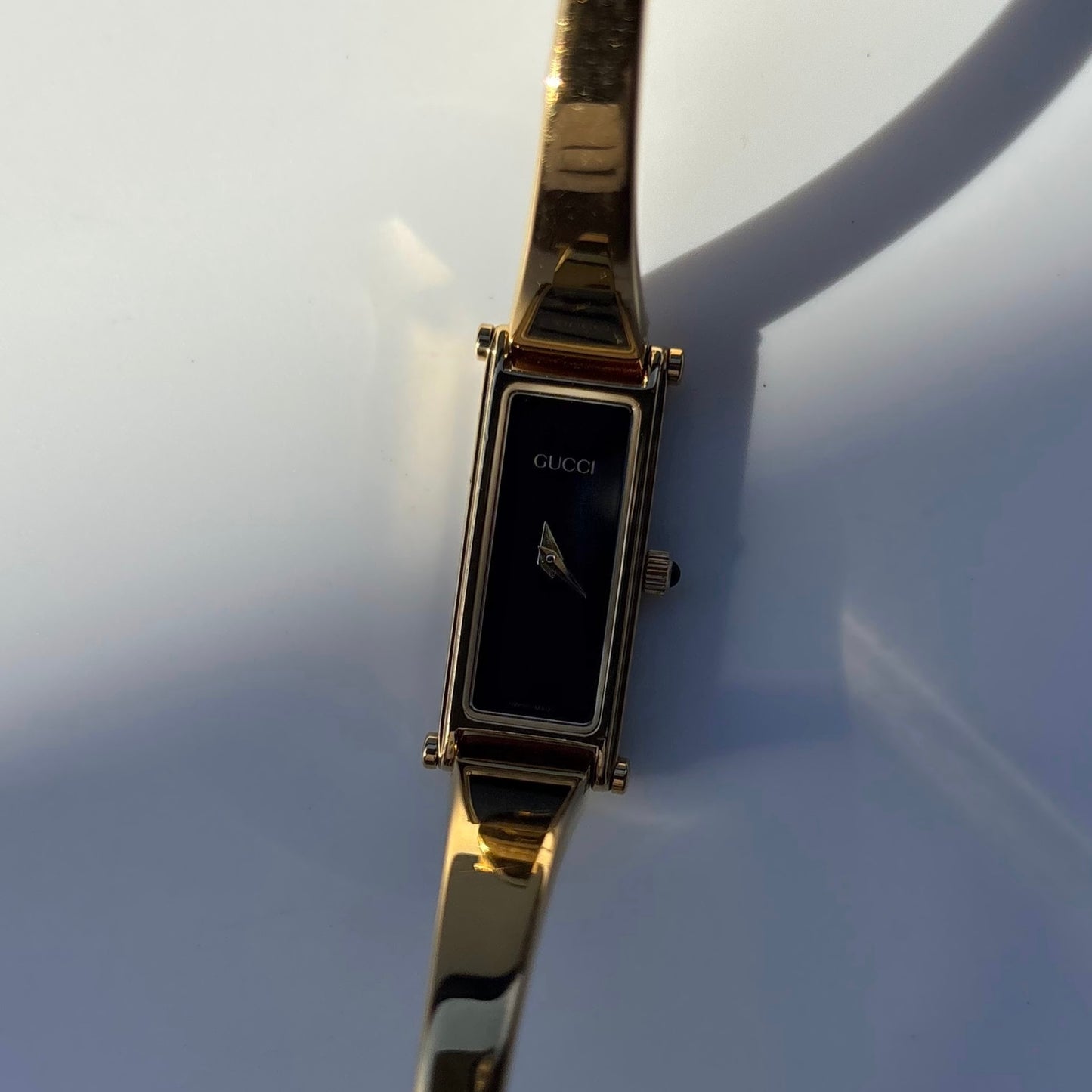 Gucci 1990s Black Dial Rectangular Gold Plated Bangle Watch