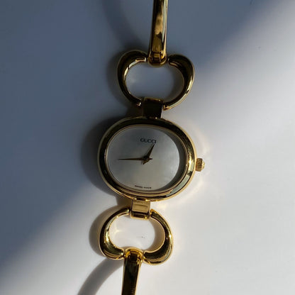 Gucci 1990s Seashell Dial Oval Gold Plated Bangle Watch