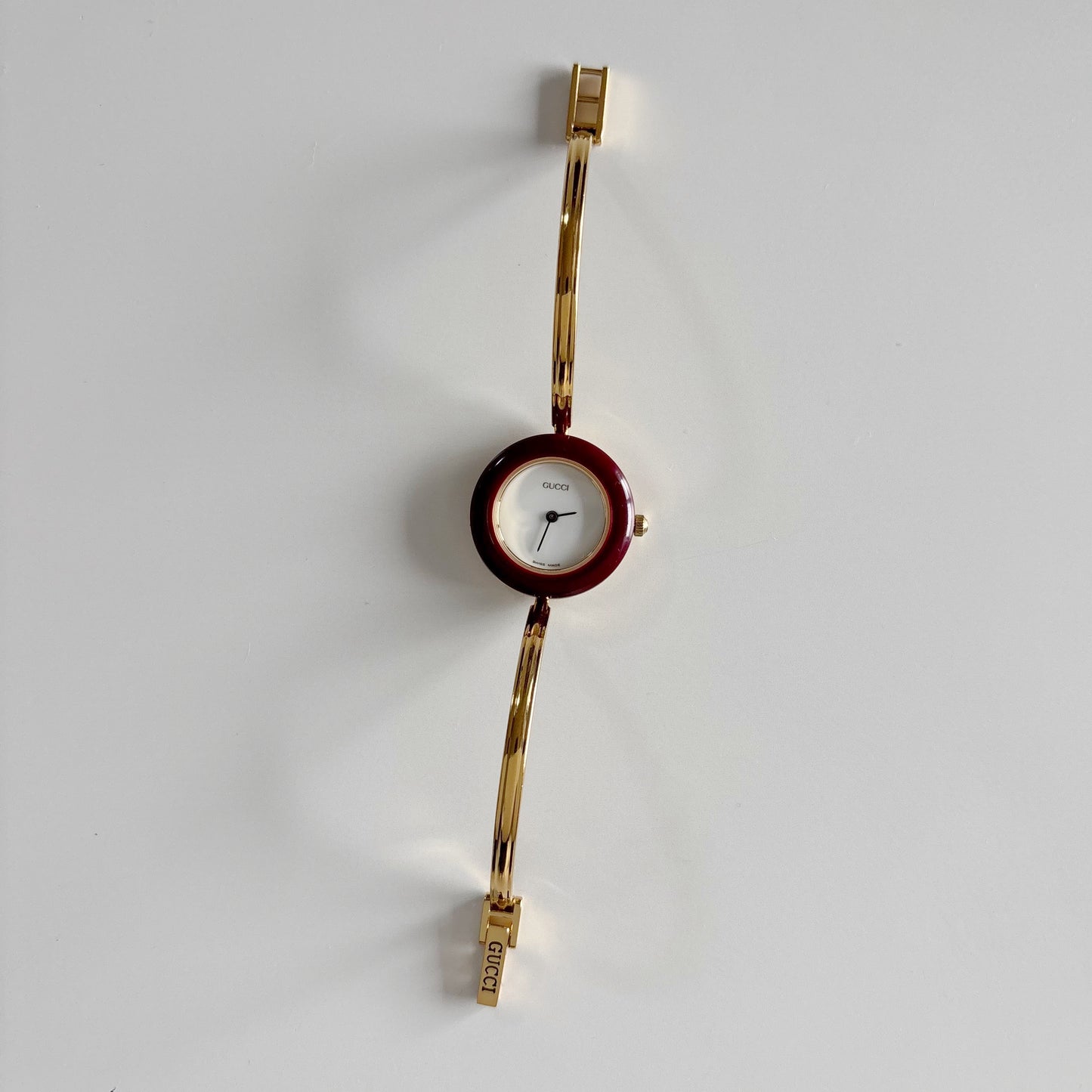 Gucci 1990s Interchangeable Bezel Gold Plated Bangle Watch with 12 bezels, case