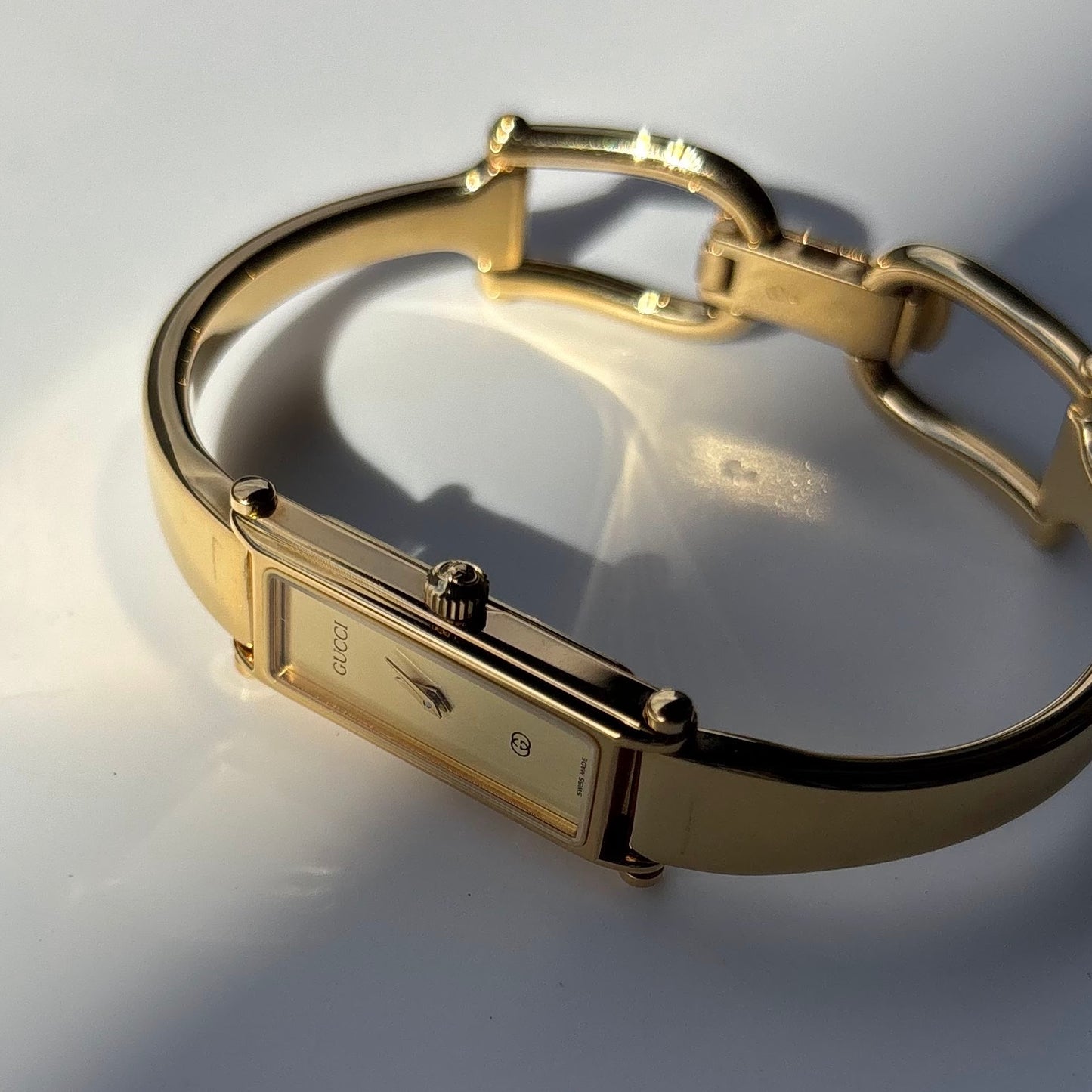 Gucci 1980s Rectangular Gold Dial Gold Plated Bangle Watch