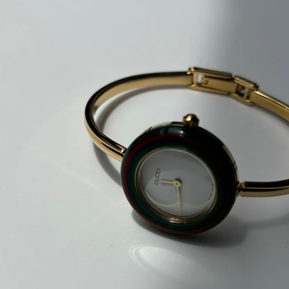 Gucci 1990s Interchangeable Bezel Gold Plated Bangle Watch with 12 bezels, case