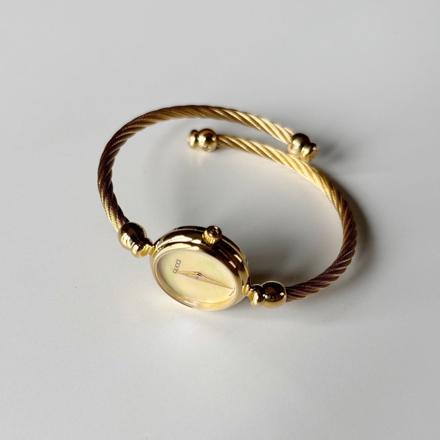 Gucci 1990s Seashell Dial Gold Plated Cable Band Bangle Watch