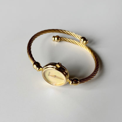 Gucci 1990s Seashell Dial Gold Plated Cable Band Bangle Watch