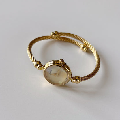 Gucci 1990s Seashell Dial Gold Plated Cable Bangle Watch