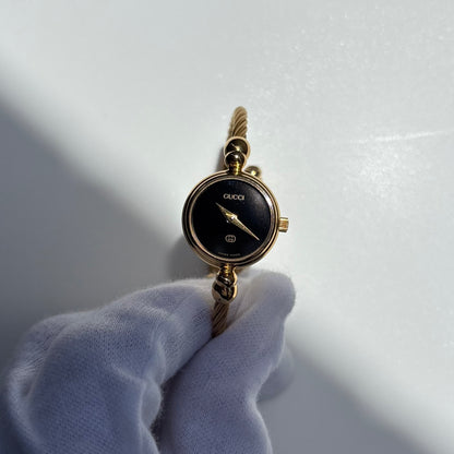 Gucci 1990s Black Round Dial Cable Gold Plated Bangle Watch