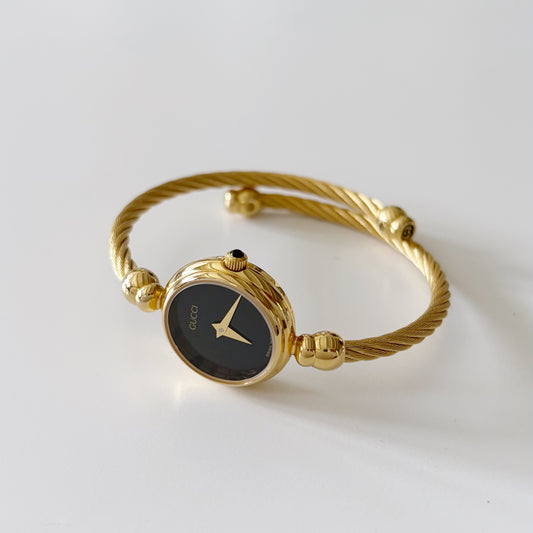 Gucci 1990s Black Dial Gold Plated Bangle Watch