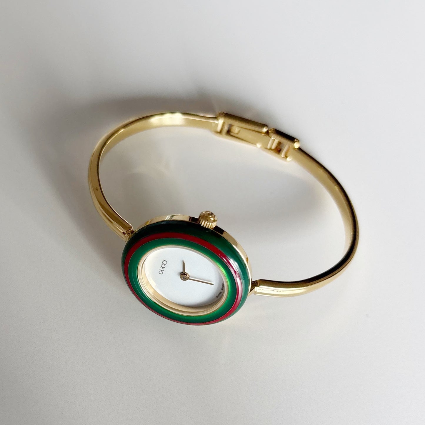 Gucci 1990s Interchangeable Bezel Gold Plated Bangle Watch with 12 bezels, case