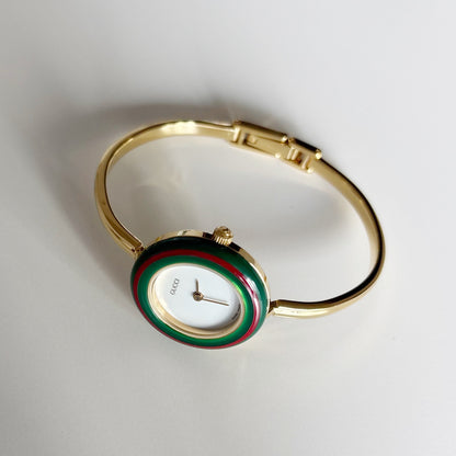 Gucci 1990s Interchangeable Bezel Gold Plated Bangle Watch with 12 bezels, case