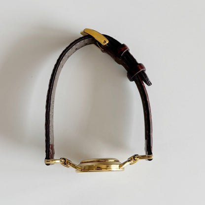 Gucci 1990s Round Dial Gold Plated Horsebit Watch