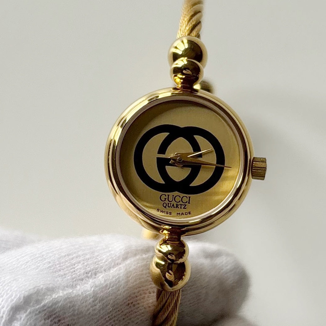 Gucci 1980s Round Dial Cable Band Bangle Watch