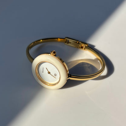 Gucci 1990s Interchangeable Bezel Gold Plated Bangle Watch with 12 bezels, case