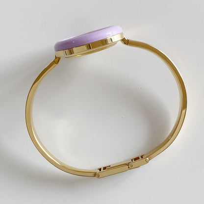 Gucci 1990s Interchangeable Bezel Gold Plated Bangle Watch with 12 bezels, case