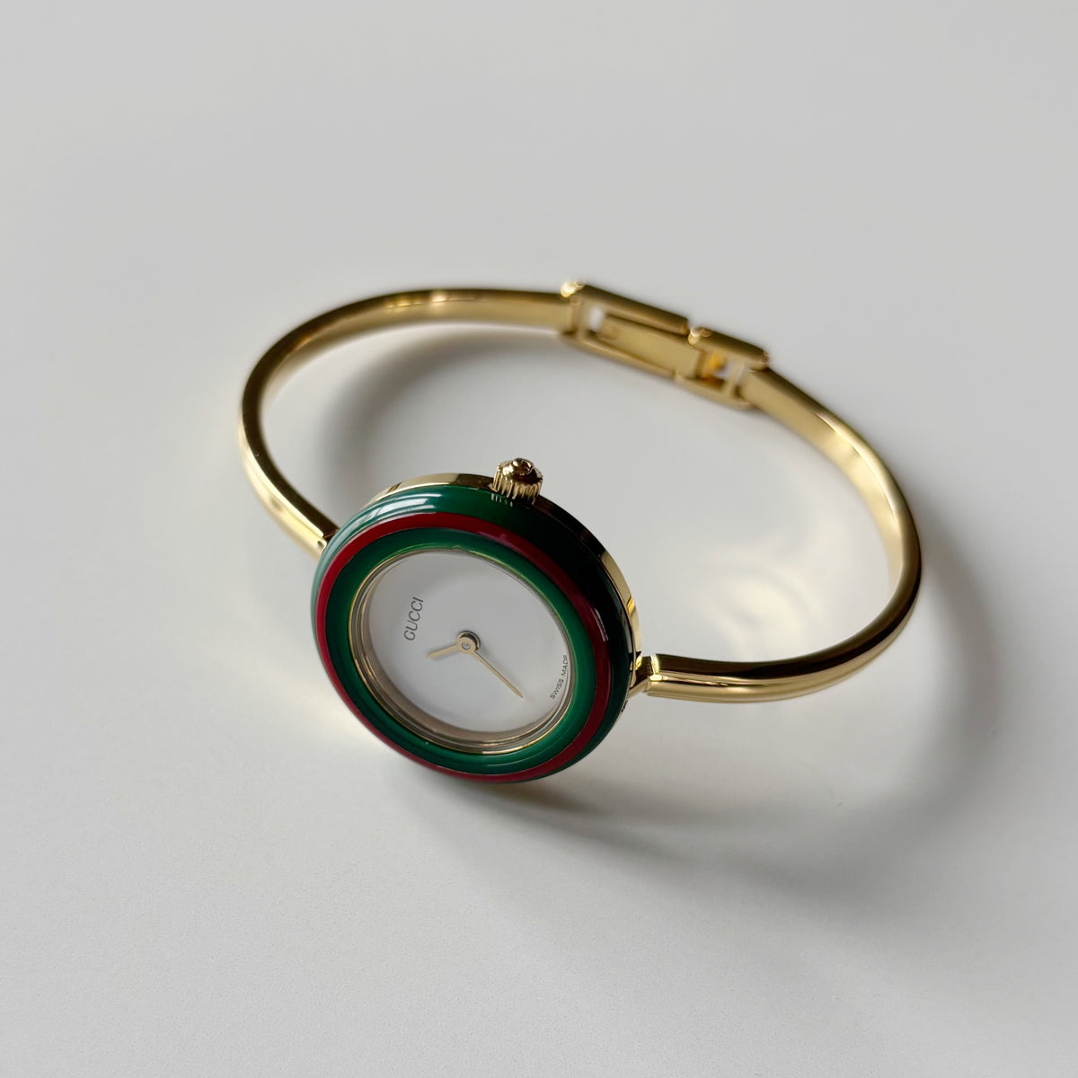Gucci 1990s Interchangeable Bezel Gold Plated Bangle Watch with 12 bezels, case