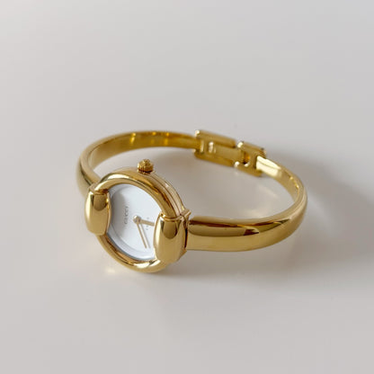 Gucci 1990s Round Dial Gold Plated Bangle Watch