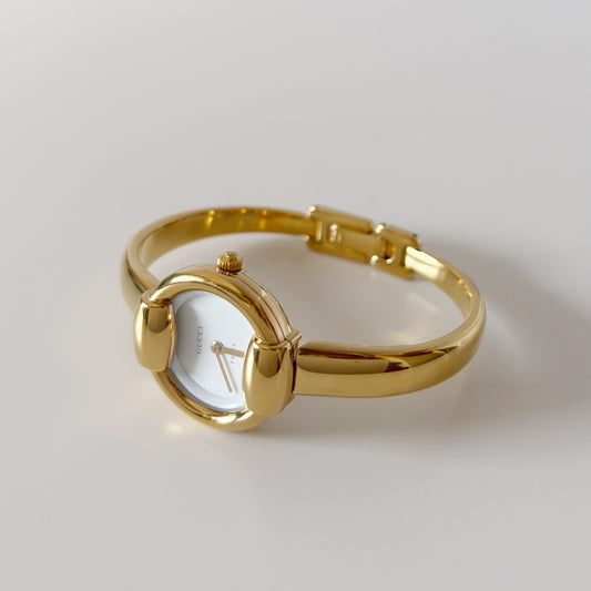 Gucci 1990s Round Dial Gold Plated Bangle Watch