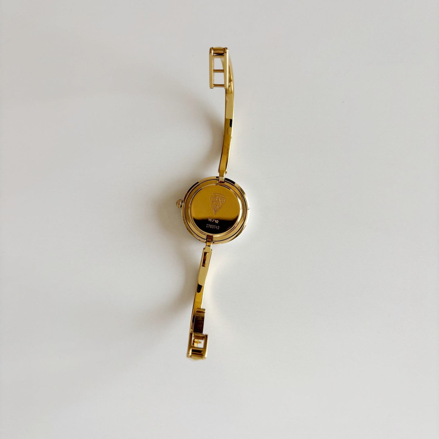 Gucci 1990s Interchangeable Bezel Gold Plated Bangle Watch with 12 bezels, case