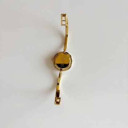 Gucci 1990s Interchangeable Bezel Gold Plated Bangle Watch with 12 bezels, case
