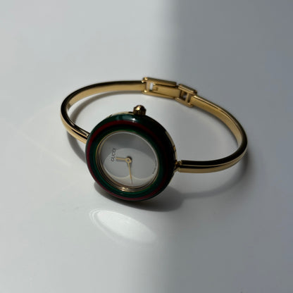 Gucci 1990s Interchangeable Bezel Gold Plated Bangle Watch with 12 bezels, case
