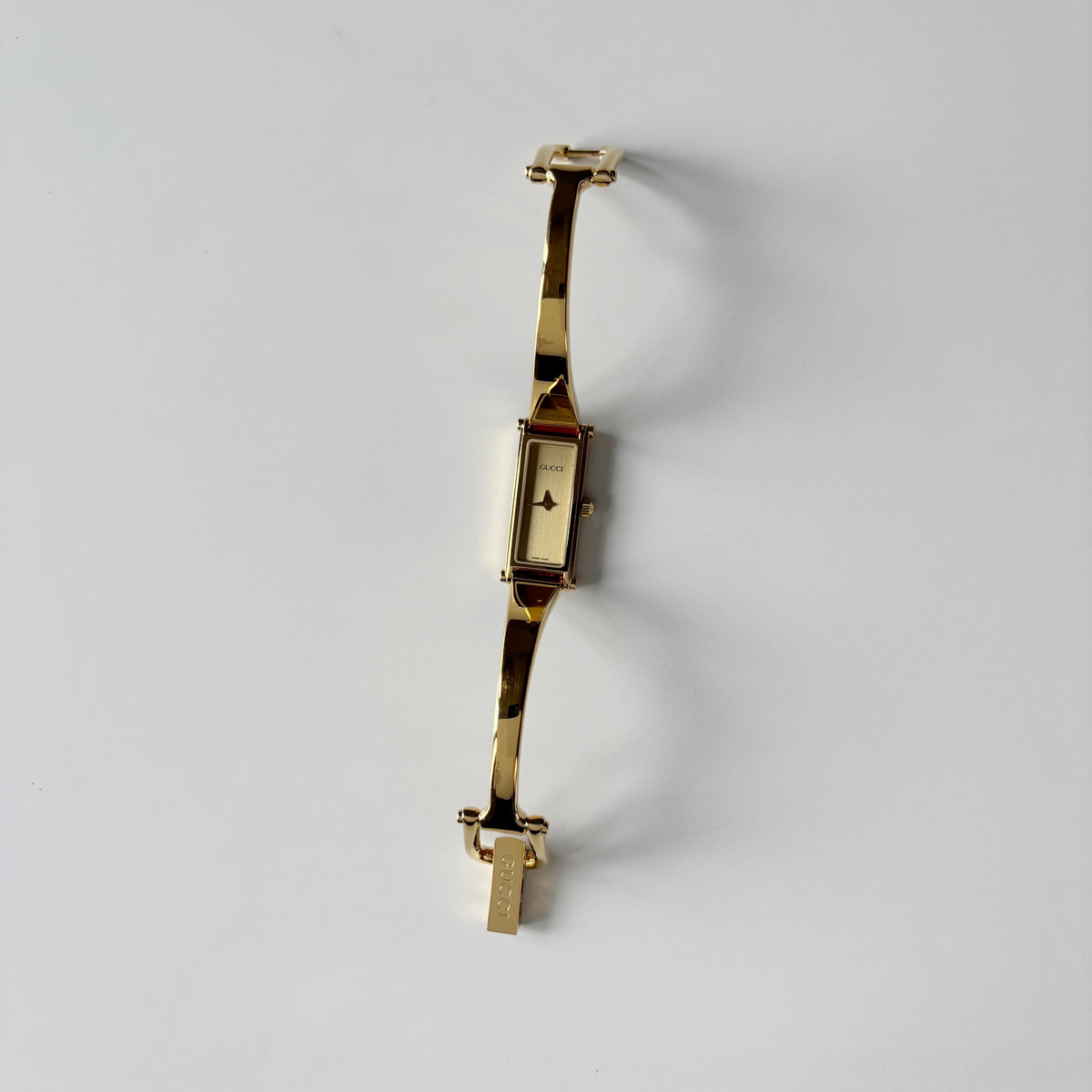 Gucci 1990s Gold Rectangular Dial Gold Plated Bangle Watch