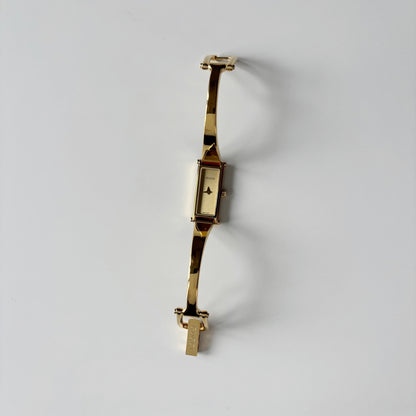 Gucci 1990s Gold Rectangular Dial Gold Plated Bangle Watch