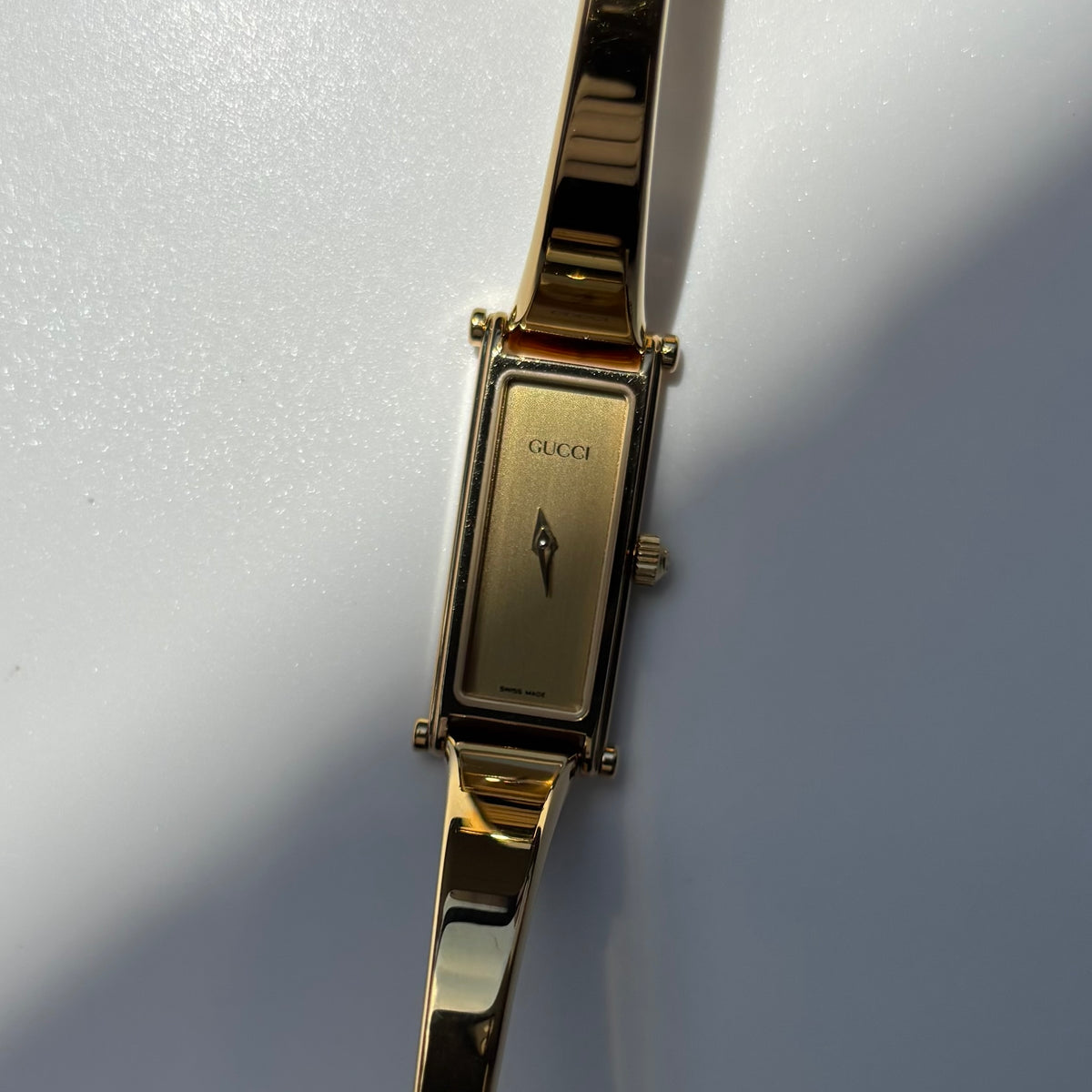 Gucci 1990s Rectangular Gold Dial Gold Plated Bangle Watch (Small)