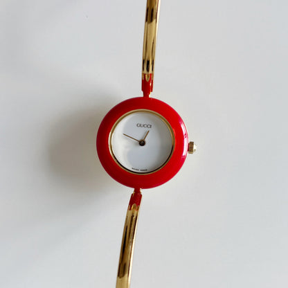 Gucci 1990s Interchangeable Bezel Gold Plated Bangle Watch with 12 bezels, case