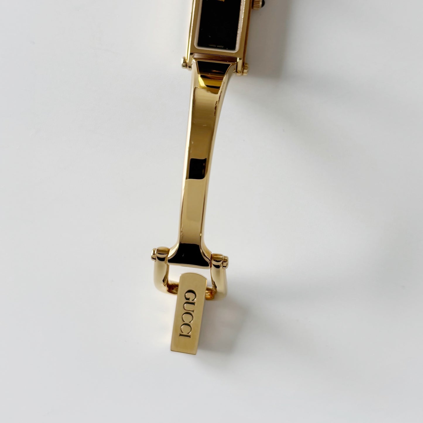 Gucci 1990s Rectangular Black Dial Gold Plated Bangle Watch