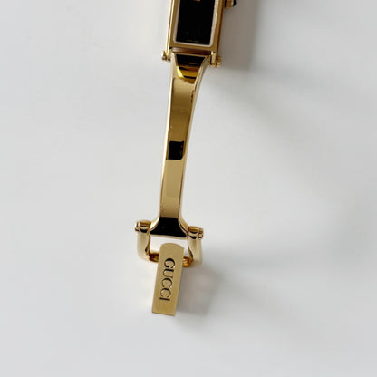 Gucci 1990s Rectangular Black Dial Gold Plated Bangle Watch