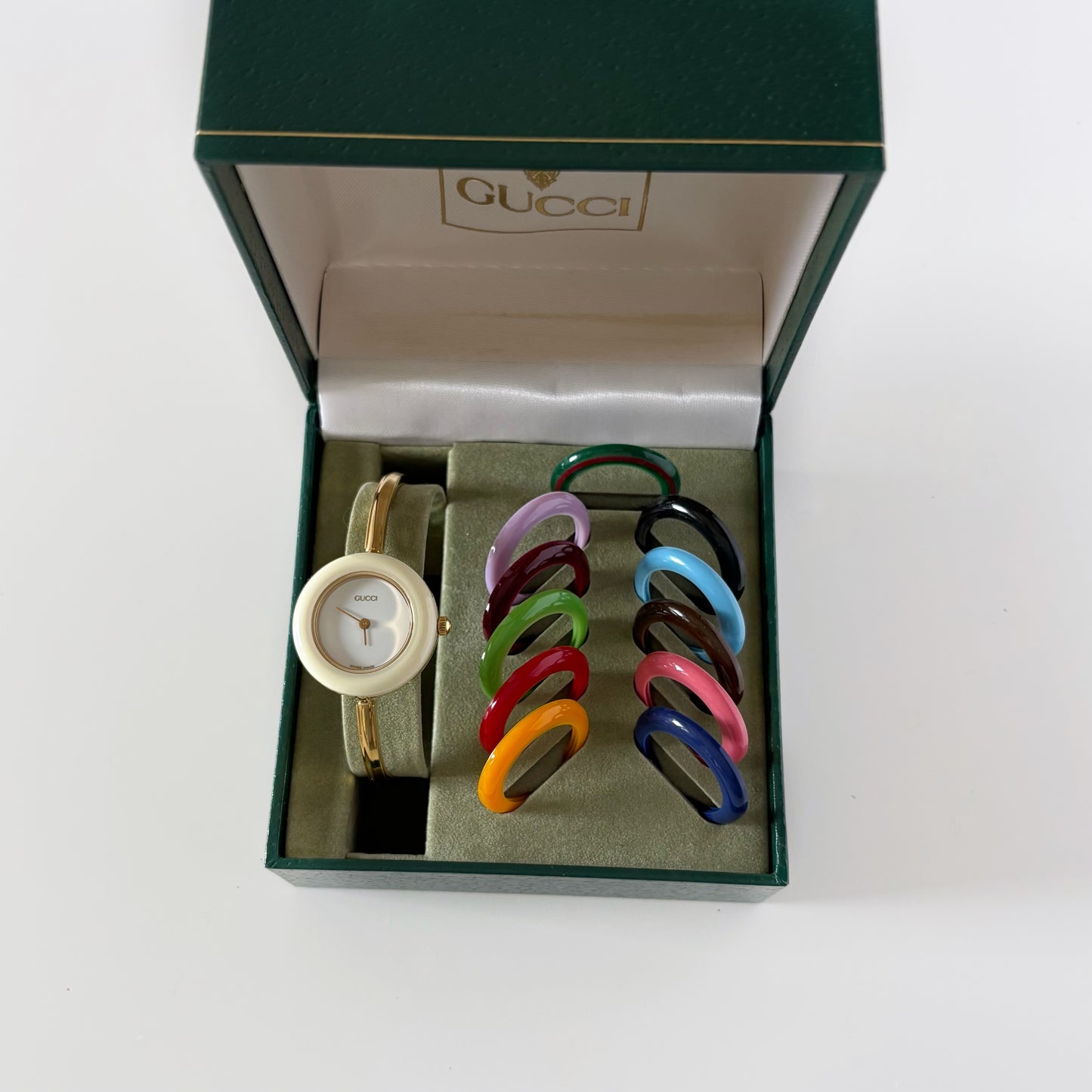 Gucci 1990s Interchangeable Bezel Gold Plated Bangle Watch with 12 bezels, case