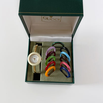 Gucci 1990s Interchangeable Bezel Gold Plated Bangle Watch with 12 bezels, case