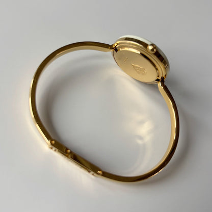 Gucci 1990s Interchangeable Bezel Gold Plated Bangle Watch with 12 bezels, case