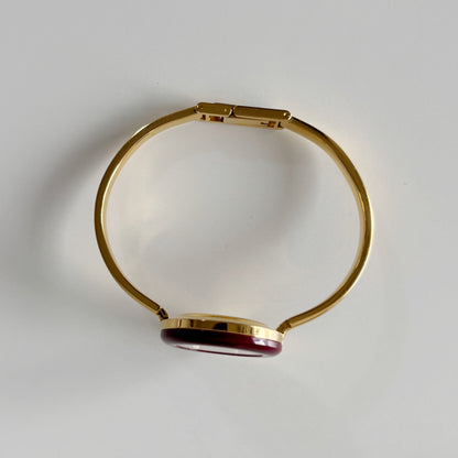 Gucci 1990s Interchangeable Bezel Gold Plated Bangle Watch with 12 bezels, case