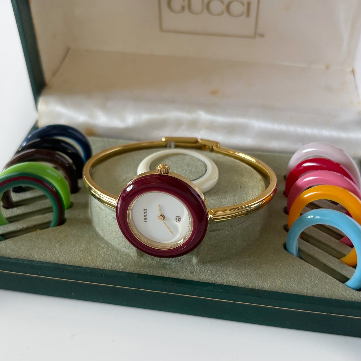 Gucci 1990s Interchangeable Bezel Gold Plated Bangle Watch with 12 bezels, case