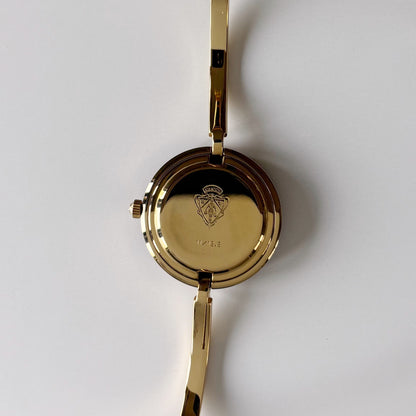 Gucci 1990s Interchangeable Bezel Gold Plated Bangle Watch with 12 bezels, case