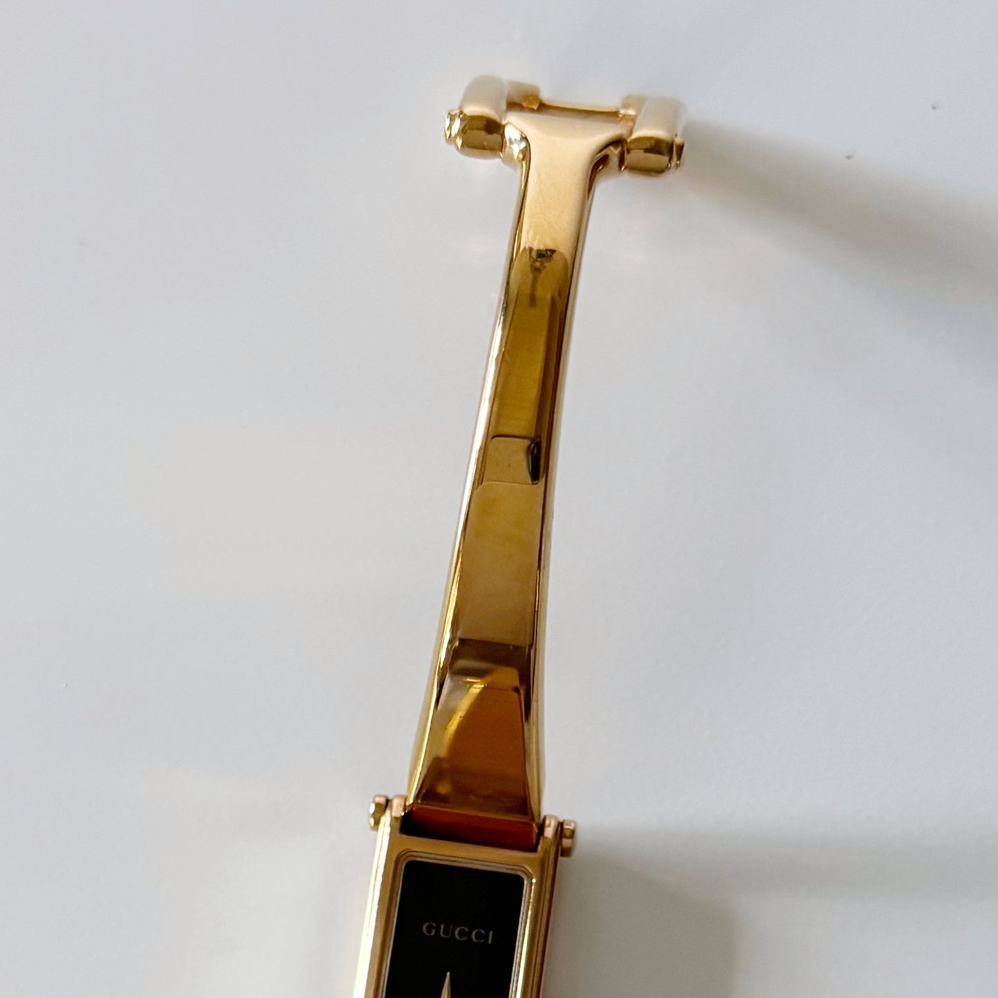 Gucci 1990s Rectangular Black Dial Gold Plated Bangle Watch