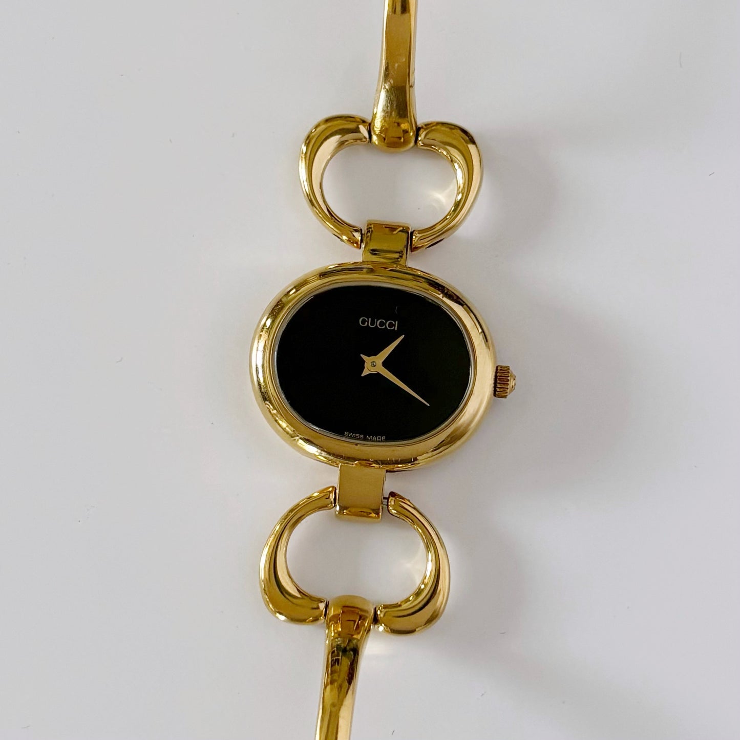 Gucci 1990s Black Dial Oval Gold Plated Bangle Watch