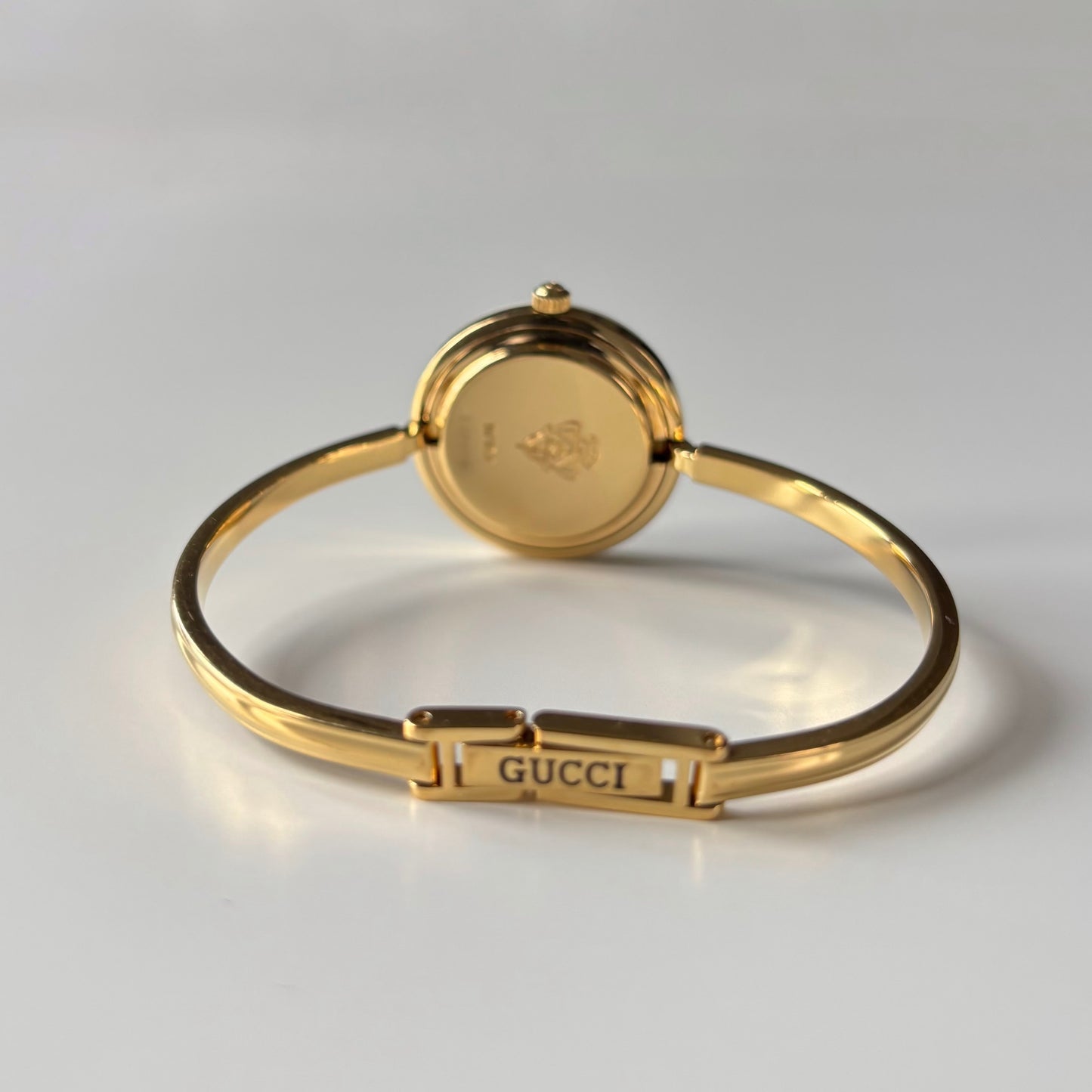 Gucci 1990s Interchangeable Bezel Gold Plated Bangle Watch with 12 bezels, case