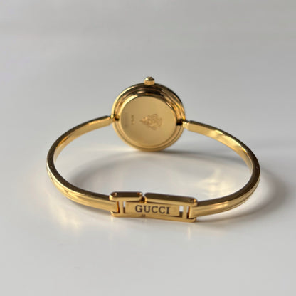 Gucci 1990s Interchangeable Bezel Gold Plated Bangle Watch with 12 bezels, case
