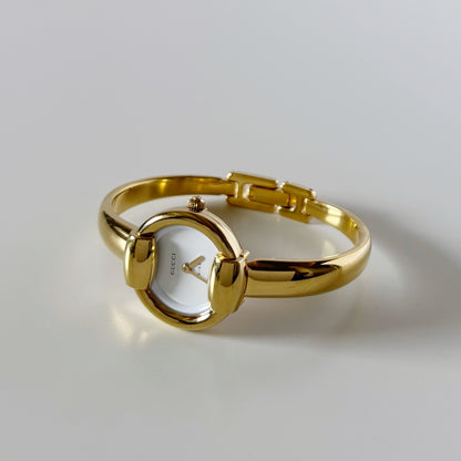 Gucci 1990s Round Dial Gold Plated Bangle Watch