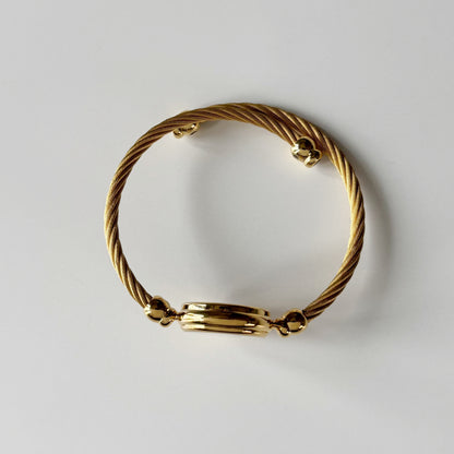 Gucci 1990s Black Round Dial Cable Gold Plated Bangle Watch