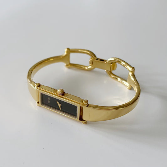 Gucci 1990s Black Dial Gold Plated Bangle Watch